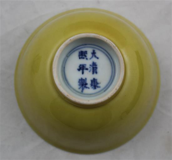 A Chinese yellow glazed small flared bowl, Kangxi six character mark and possibly of the period, diam. 9.5cm